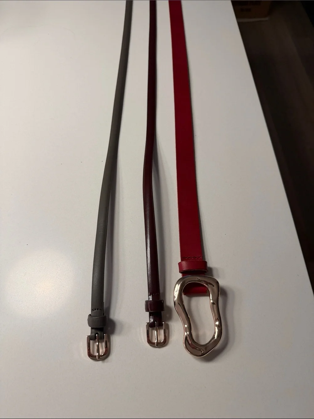 Three pair bundle. Anthropologie Red Leather Waist Belt, H&Mgrey and plum belt.